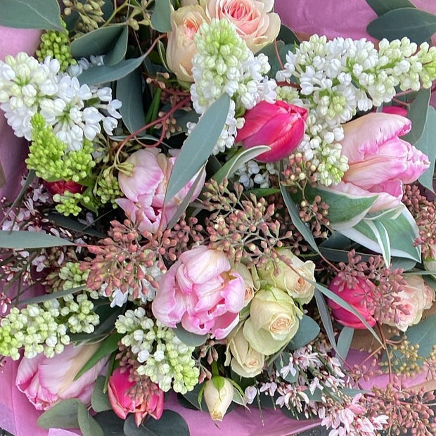 Miniature bouquet in pink and white of Garden Spray roses, Syringa, Ginster and Tulips, with populous foliage, smells divine 